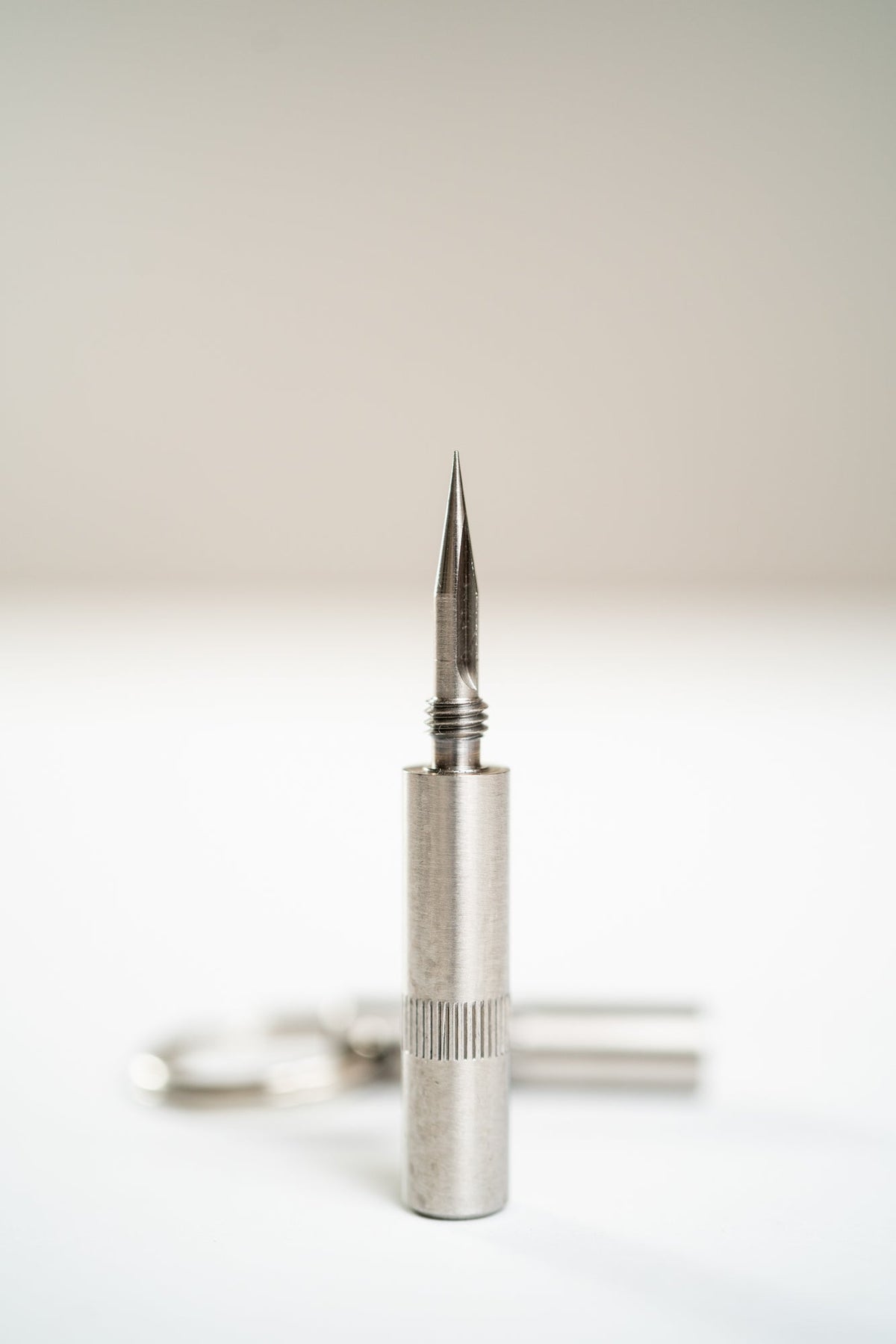 "Trilogy" Cigar Punch . Silver tool with pointed triangle top for premium cigars