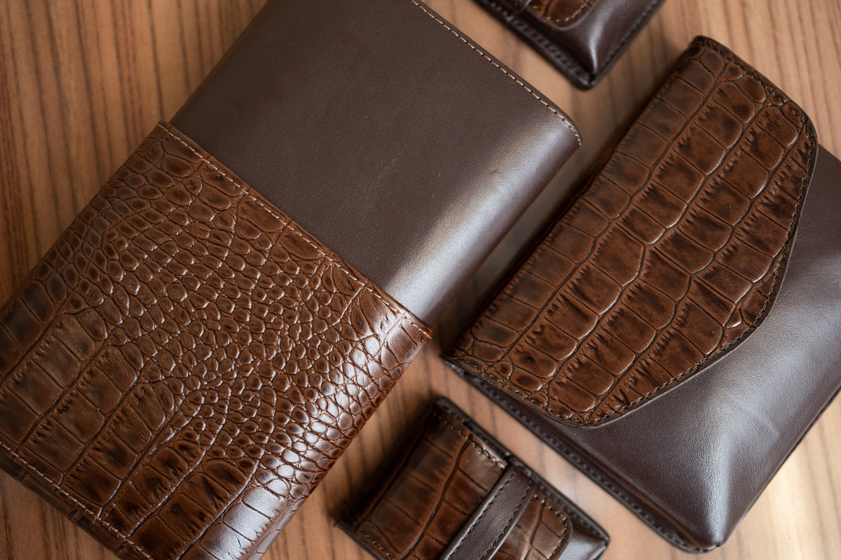 luxury cigar store for traveling. Brown leather crocodile pattern