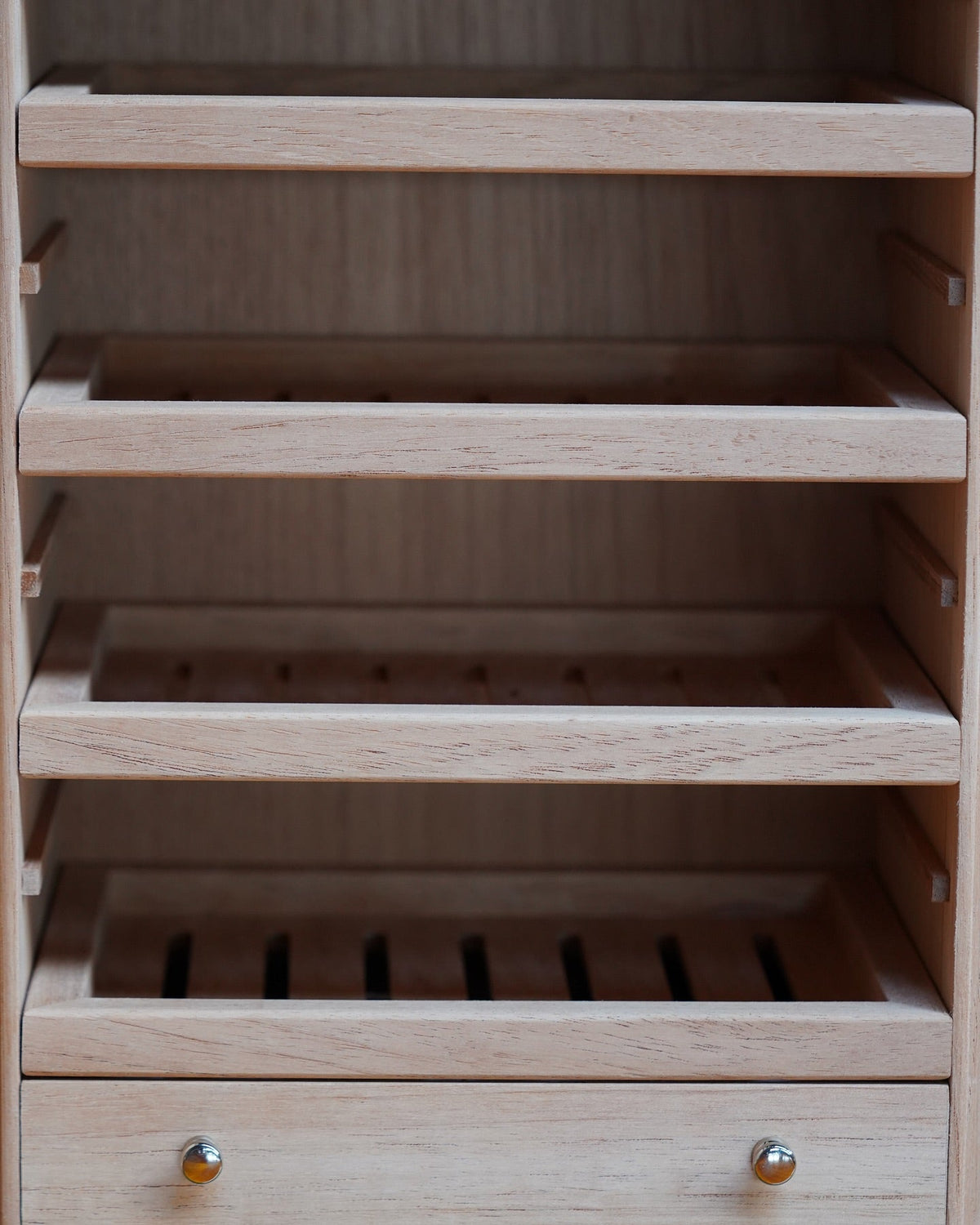 inside of Maccarrone dea tyche humidor cabinet with cedar drawers